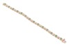 An emerald line bracelet, comprising fourteen round-cut emeralds, interspersed by stylised cross forms and a white-metal illusion panel, every other white metal panel illusion-set with a rose-cut diamond, measuring 18.0cm in length, completed with an inte - 2
