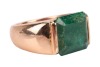 An emerald dress ring, featuring a deep green coloured emerald with sub-translucent transparency, approximately measuring 11.1 x 12.1 mm, bar set on a yellow metal mount surface tested as 18ct, with trumpeted shoulders to a court profile shank, unmarked, - 3