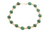 An agate bead necklace, comprising fourteen spherical dyed agate beads of 16.5mm, capped with graduated cups, completed with a hook clasp with twisted cable details, unmarked yellow metal surface testing as 18ct, overall length 43.0 cm, 99.6 grams. Please
