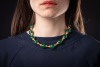 An agate bead necklace, comprising fourteen spherical dyed agate beads of 16.5mm, capped with graduated cups, completed with a hook clasp with twisted cable details, unmarked yellow metal surface testing as 18ct, overall length 43.0 cm, 99.6 grams. Please - 3