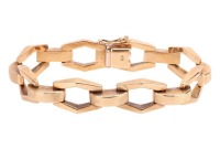 An angular link bracelet, composed of stylised hexagonal openwork links, each connected by a domed rectangular link with Florentine finish, completed with an integral box clasp and additional safety catch, 16.5cm in length, 1.0cm in width, the clasp marke
