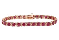A fracture-filled ruby and diamond-set bracelet, claw-set with fracture-filled rubies and round brilliant diamonds, in a yellow metal mount marked &lsquo;14K&rsquo;, with integrated push bar clasp and safety catch; 12.3 grams