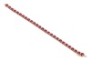 A fracture-filled ruby and diamond-set bracelet, claw-set with fracture-filled rubies and round brilliant diamonds, in a yellow metal mount marked &lsquo;14K&rsquo;, with integrated push bar clasp and safety catch; 12.3 grams - 2