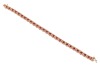 A fracture-filled ruby and diamond-set bracelet, claw-set with fracture-filled rubies and round brilliant diamonds, in a yellow metal mount marked &lsquo;14K&rsquo;, with integrated push bar clasp and safety catch; 12.3 grams - 3