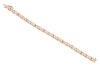 A gem-set floral bracelet, the crossover links with flower motifs, set with round brilliant diamonds and round pink sapphires, in an alternating pattern, to a bi-colour metal mount, with integrated push bar clasp and safety catch, marked &lsquo;14K&rsquo;; 8.0 grams - 2