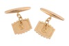 A pair of ridged cufflinks, the panels with vertical grooves, chain connected to torpedo fittings, yellow metal marked '18ct', 9.10 grams. - 2