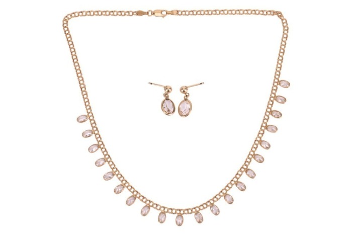 A gem-set fringe necklace with matching earrings, composed of twenty-one oval-cut paste, bezel-set and suspended from a figure-of-eight link chain, in yellow metal marked &lsquo;750&rsquo;, together with a pair of paste-set drop earrings, with no earring backs; 11.0 