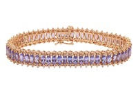 A tanzanite and diamond-set bracelet, by Iliana, composed of a row of marquise-cut tanzanites, claw-set between round brilliant diamonds, in a yellow metal mount marked &lsquo;18K&rsquo;, with integrated push bar clasp and safety catch, measuring approximately 20.5cm
