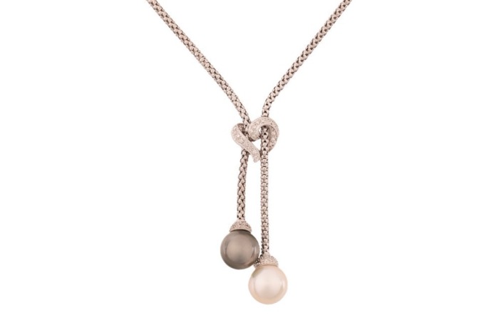 A double pearl lariat necklace, composed of pocorn link chain, with two cultured pearls at each terminal, of cream and grey body colour, measuring approximately 12.2mm each, set beneath a diamond-set stylised heart motif, in white metal marked &lsquo;18K&rsquo;, with