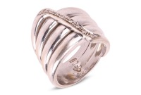 A diamond-set coil ring, by Maria Grazia Cassetti, centrally embellished with an applied zig-zag motif encrusted with diamond accents, white metal signed and bearing Italian assay marks '750' and registration marks, 1.5 cm wide, size Q, 19.7 grams.