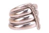 A diamond-set coil ring, by Maria Grazia Cassetti, centrally embellished with an applied zig-zag motif encrusted with diamond accents, white metal signed and bearing Italian assay marks '750' and registration marks, 1.5 cm wide, size Q, 19.7 grams. - 4