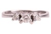 A diamond-set half-hoop ring in 14ct white gold, with an estimated total diamond weight of 0.40ct, comprising three graduated round brilliant-cut diamonds, in claw settings to a tapering shank, Sheffield hallmarks, size R, 3.5 grams. - 3