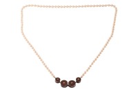 A long cultured pearl necklace with a Modernist centrepiece, comprising four cylinders each set with a diamond accent on both sides, attached to a hand-knotted strand of round cultured pearls, measuring 6.2 mm in diameter, metal testing as silver and 18ct