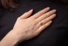 A cultured pearl solitaire ring, the cultured pearl measuring approximately 8.3mm, with diamond-set crossover-style shoulders, to a white metal mount, marks rubbed, surface tested as 18ct, size P1/2; 3.7 grams Please note: Unless otherwise stated, lots ha - 2