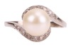 A cultured pearl solitaire ring, the cultured pearl measuring approximately 8.3mm, with diamond-set crossover-style shoulders, to a white metal mount, marks rubbed, surface tested as 18ct, size P1/2; 3.7 grams Please note: Unless otherwise stated, lots ha - 3