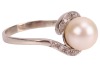 A cultured pearl solitaire ring, the cultured pearl measuring approximately 8.3mm, with diamond-set crossover-style shoulders, to a white metal mount, marks rubbed, surface tested as 18ct, size P1/2; 3.7 grams Please note: Unless otherwise stated, lots ha - 4