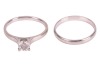 A diamond solitaire ring and a band ring, the solitaire featuring a claw-set round brilliant-cut diamond of estimated 0.83ct, to a plain platinum ring shank, size T, 5.24 grams, together with a plain platinum band ring, size T &frac12;, 3.6 grams. Together with - 2