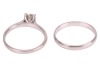 A diamond solitaire ring and a band ring, the solitaire featuring a claw-set round brilliant-cut diamond of estimated 0.83ct, to a plain platinum ring shank, size T, 5.24 grams, together with a plain platinum band ring, size T &frac12;, 3.6 grams. Together with - 3