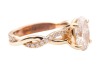 A laboratory-grown diamond solitaire ring, centred with an oval-cut diamond of 1.51ct, between twisted diamond-set shoulders leading to shank, in unmarked yellow metal surface testing as 14ct, size K, 4.3 grams. Diamond has been inscribed with an IGI repo - 3