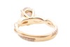 A laboratory-grown diamond solitaire ring, centred with an oval-cut diamond of 1.51ct, between twisted diamond-set shoulders leading to shank, in unmarked yellow metal surface testing as 14ct, size K, 4.3 grams. Diamond has been inscribed with an IGI repo - 4