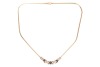 A sapphire and diamond-set necklace, set with three claw-set oval sapphires and four round brilliant diamonds, in a slightly curved mount featuring &lsquo;X&rsquo;-style links, to a flat snake-link chain to a lobster clasp, in yellow metal marked &lsquo;14K&rsquo;, measuring app - 2