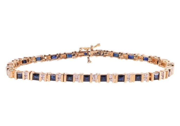 A sapphire and diamond line bracelet, comprising twenty-five square-cut sapphires channel-set in yellow metal, each sapphire interspersed with two channel-set round brilliant-cut diamonds, bracelet measuring approximately 17.5cm in length, completed with 