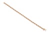 A sapphire and diamond line bracelet, comprising twenty-five square-cut sapphires channel-set in yellow metal, each sapphire interspersed with two channel-set round brilliant-cut diamonds, bracelet measuring approximately 17.5cm in length, completed with - 3