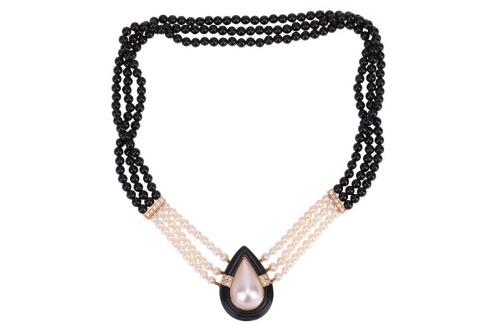 A Mab&eacute; pearl and onyx necklace, comprising three rows of cultured pearls and round onyx beads, bar spacers set with rows of diamond accents, the teardrop-shaped centre piece functioning as a box clasp, centred with a mab&eacute; pearl within a conforming hardsto