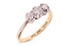 A diamond-set three-stone ring, claw-set with three round brilliant diamonds, with an estimated total diamond carat weight of 0.43ct, to a bi-colour metal mount marked &lsquo;18ct&rsquo; and &lsquo;Plat&rsquo;, size N1/2; 2.8 grams