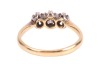 A diamond-set three-stone ring, claw-set with three round brilliant diamonds, with an estimated total diamond carat weight of 0.43ct, to a bi-colour metal mount marked &lsquo;18ct&rsquo; and &lsquo;Plat&rsquo;, size N1/2; 2.8 grams - 2