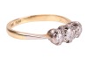A diamond-set three-stone ring, claw-set with three round brilliant diamonds, with an estimated total diamond carat weight of 0.43ct, to a bi-colour metal mount marked &lsquo;18ct&rsquo; and &lsquo;Plat&rsquo;, size N1/2; 2.8 grams - 3