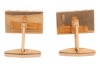 A pair of cufflinks of rectangular form with striated design, the panels fitted with toggle swivels, yellow metal marked '750', panel measures 2.0 x 1.3 cm, total weight of items 16.73 grams. - 2