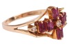 A ruby and diamond dress ring, six rectangular table-cut rubies and three single-cut diamonds composing a cruciform, between bifurcated shoulders leading to an angular shank, yellow metal stamped '585', size L, 2.8 grams. - 4