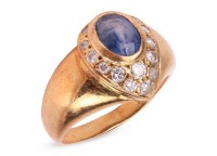 A sapphire and diamond dress ring, the egg-shaped ring head collet-set with an oval-cut sapphire of 7.0 x 5.5 x 4.2 mm, in surround bead-set with round brilliant-cut diamonds, leading to tapering shank in yellow metal marked '750', ring head 1.5 x 1.1 cm,