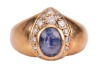 A sapphire and diamond dress ring, the egg-shaped ring head collet-set with an oval-cut sapphire of 7.0 x 5.5 x 4.2 mm, in surround bead-set with round brilliant-cut diamonds, leading to tapering shank in yellow metal marked '750', ring head 1.5 x 1.1 cm, - 2