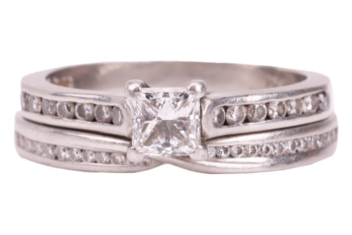 A single stone diamond ring, the princess-cut diamond claw-mounted in platinum above channel-set diamond shoulders, accompanied by a GIA report stating that the diamond is E, VS1 and 0.41 carats; together with a platinum and diamond set crossover wedding 
