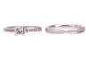 A single stone diamond ring, the princess-cut diamond claw-mounted in platinum above channel-set diamond shoulders, accompanied by a GIA report stating that the diamond is E, VS1 and 0.41 carats; together with a platinum and diamond set crossover wedding - 3