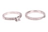A single stone diamond ring, the princess-cut diamond claw-mounted in platinum above channel-set diamond shoulders, accompanied by a GIA report stating that the diamond is E, VS1 and 0.41 carats; together with a platinum and diamond set crossover wedding - 4