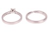 A single stone diamond ring, the princess-cut diamond claw-mounted in platinum above channel-set diamond shoulders, accompanied by a GIA report stating that the diamond is E, VS1 and 0.41 carats; together with a platinum and diamond set crossover wedding - 5