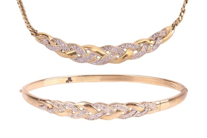 A diamond-set hinged bangle, of interlocking woven design, partly set with round brilliant diamonds, with integrated push bar clasp, marked &lsquo;375&rsquo;, together with a matching necklace, the curved bar of similar design, and leading to a flat link chain, with 