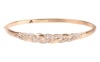 A diamond-set hinged bangle, of interlocking woven design, partly set with round brilliant diamonds, with integrated push bar clasp, marked &lsquo;375&rsquo;, together with a matching necklace, the curved bar of similar design, and leading to a flat link chain, with - 2
