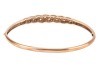 A diamond-set hinged bangle, of interlocking woven design, partly set with round brilliant diamonds, with integrated push bar clasp, marked &lsquo;375&rsquo;, together with a matching necklace, the curved bar of similar design, and leading to a flat link chain, with - 3
