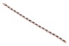 A sapphire and diamond-set bracelet, with marquise-cut sapphires, set at an angle, interspersed by diamond-set links, in a yellow metal mount, with integrated clasp and safety catch, marked &lsquo;14K&rsquo;, measuring approximately 18.9cm; 12.0 grams - 2