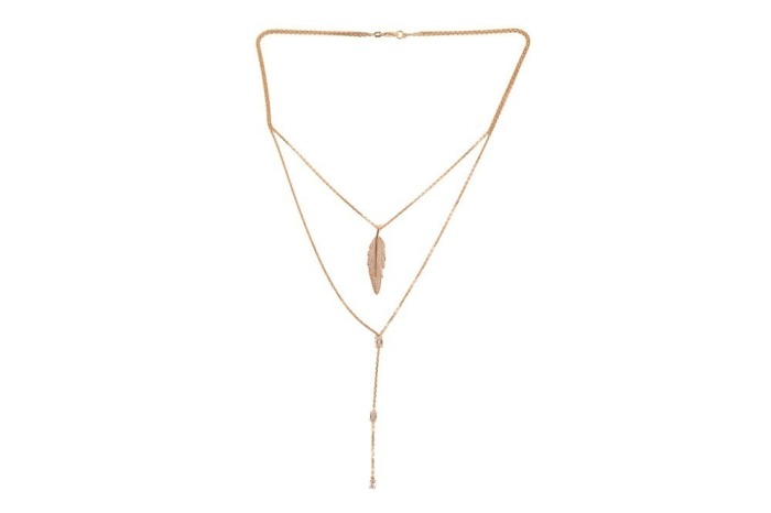 A double-strand diamond-set feather necklace, featuring a feather pendant, grain-set with round brilliant-cut diamonds and suspended from a yellow metal cable-link chain, the second cable link chain suspending a drop of three emerald-cut diamonds, intersp