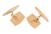 A pair of ridged cufflinks, the panels with vertical grooves, chain connected to torpedo bar fittings, yellow metal marked '18ct', 9.95 grams. - 2