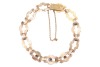 A fancy link bracelet set with pearl and sapphire, comprising a series of hinged geometric links, centred with a circular-cut sapphire in a millgrained collet, flanked by two split pearls, completed with a conforming box clasp, metal stamped '585', overal - 2