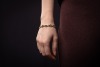 A fancy link bracelet set with pearl and sapphire, comprising a series of hinged geometric links, centred with a circular-cut sapphire in a millgrained collet, flanked by two split pearls, completed with a conforming box clasp, metal stamped '585', overal - 3