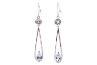 A pair of drop earrings set with aquamarine and topaz, the wire pendant drop claw-set with a pear-cut aquamarine, suspending from a surmount collet-set with a circular-cut topaz, hook fittings, white metal marked '750' and surface testing as 18ct, 6.0 cm 