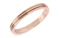 Cartier &ndash; An 18ct gold &lsquo;Trinity Vendome Louis&rsquo; tricolour band ring, featuring three 1.0mm wide bands of yellow, white and rose gold, the ring signed &lsquo;Cartier&rsquo; and marked &lsquo;977103&rsquo;, dated 1988, size T, 3.93 grams.