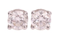 Tiffany & Co. - A pair of diamond stud earrings in platinum, with an estimated total diamond weight of 0.60ct, each containing a brilliant-cut diamond of 4.3mm in a claw setting, screw-back fittings to the reverse, signed and numbered, London 2004, 1.4 gr